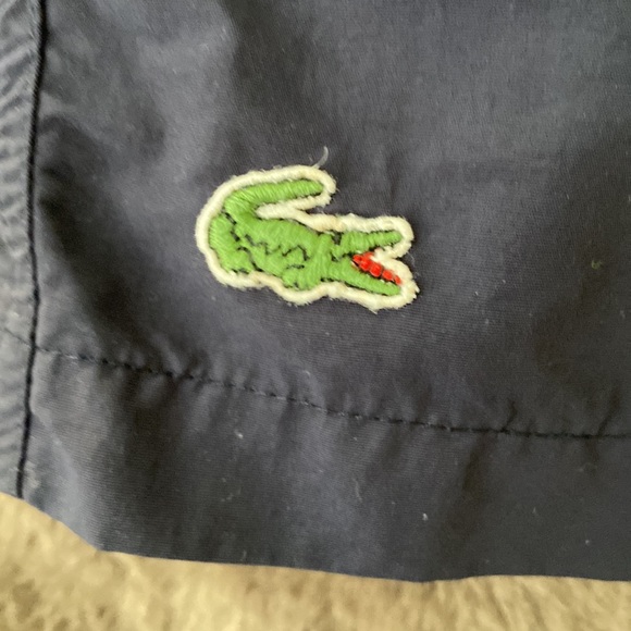 A Lacoste men’s quick-dry swim shorts with built in mesh lining. - Picture 2 of 8